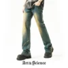 A model wearing blue denim trousers featuring vintage yellow fading and diagonal panel stitching, paired with black platform shoes. The "Art & Science" brand logo is at the bottom.