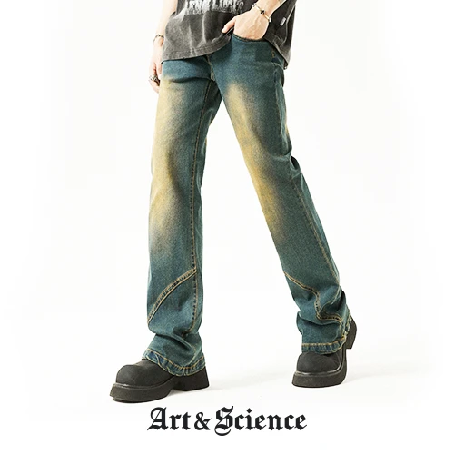 A model wearing blue denim trousers featuring vintage yellow fading and diagonal panel stitching, paired with black platform shoes. The "Art & Science" brand logo is at the bottom.