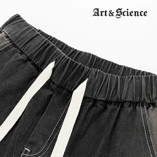 Close-up detail of the adjustable drawstring and elastic waistband on Art and Science premium dark grey trousers, showcasing quality stitching and durable materials.