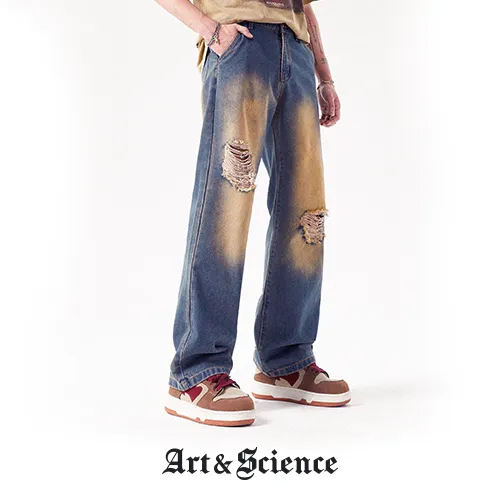 Close-up of reinforced knee panel on tech denim pants