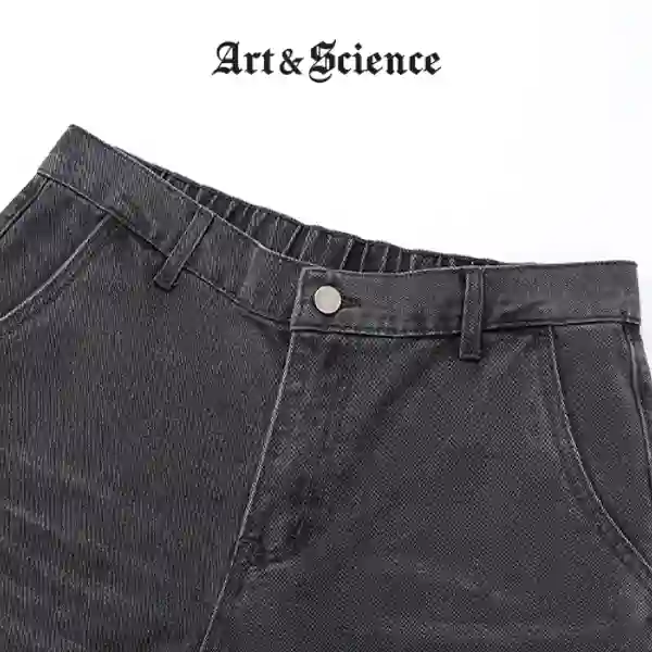 Hardware and strap details on black denim vest